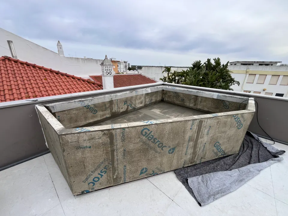 Terrace with planters and jacuzzi, before