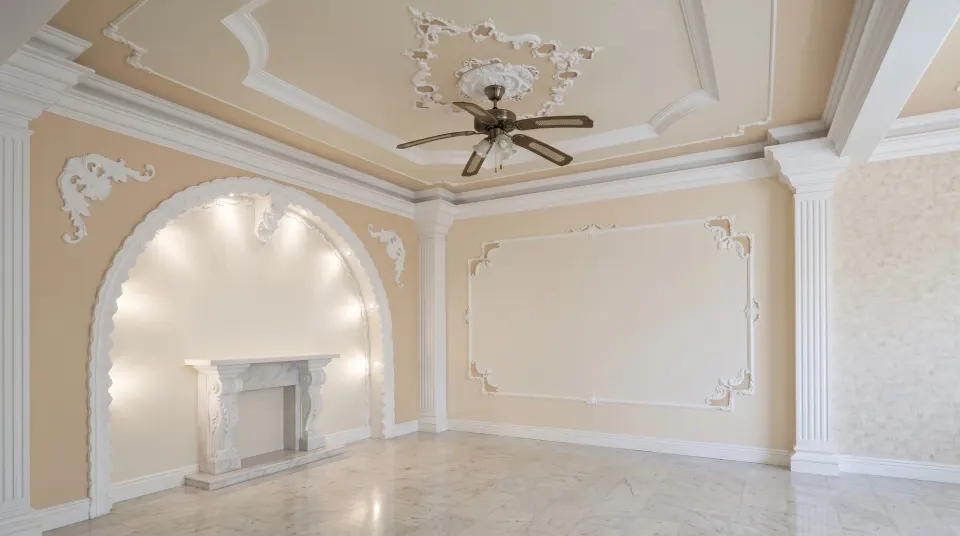 Living room with an illuminated arch, a marble fireplace and plaster mouldings on the ceiling and walls